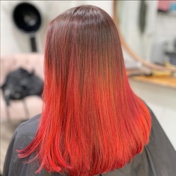 Red hair coloration and styling by Naomi Meadowcroft