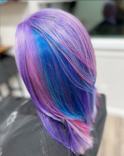 Purple and blue hair coloration and styling by Naomi Meadowcroft